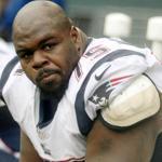 New England Patriots ' Vince Wilfork reacts on the bench near the end of an NFL football game against the Seattle Seahawks, Sunday, Oct. 14, 2012, in Seattle. The Seahawks beat the Patriots 24-23. (AP Photo/John Froschauer)